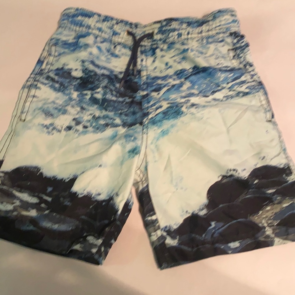 Boys Blue ocean swim trunks.